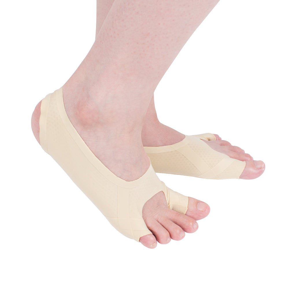 Sock-style bunion corrector A25B worn on foot in skin color