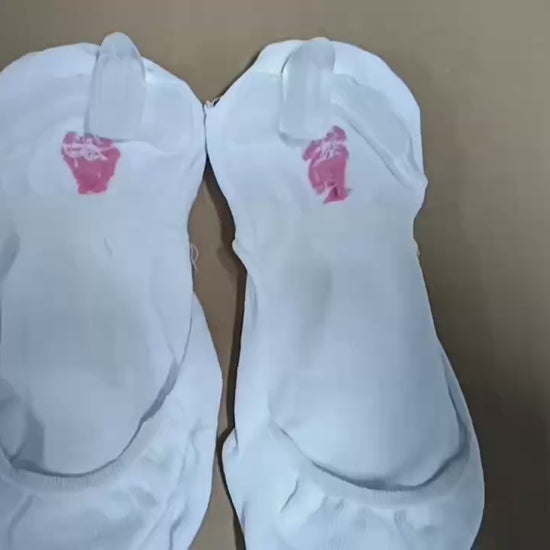 Woman wearing beige bunion socks inside casual shoes