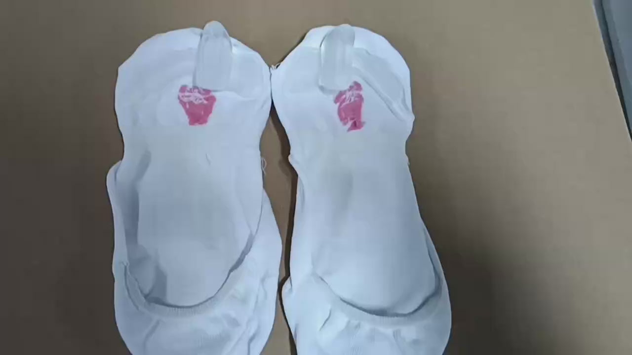 Woman wearing beige bunion socks inside casual shoes